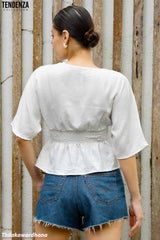 Tendenza V Neck Smocked Peplum Top